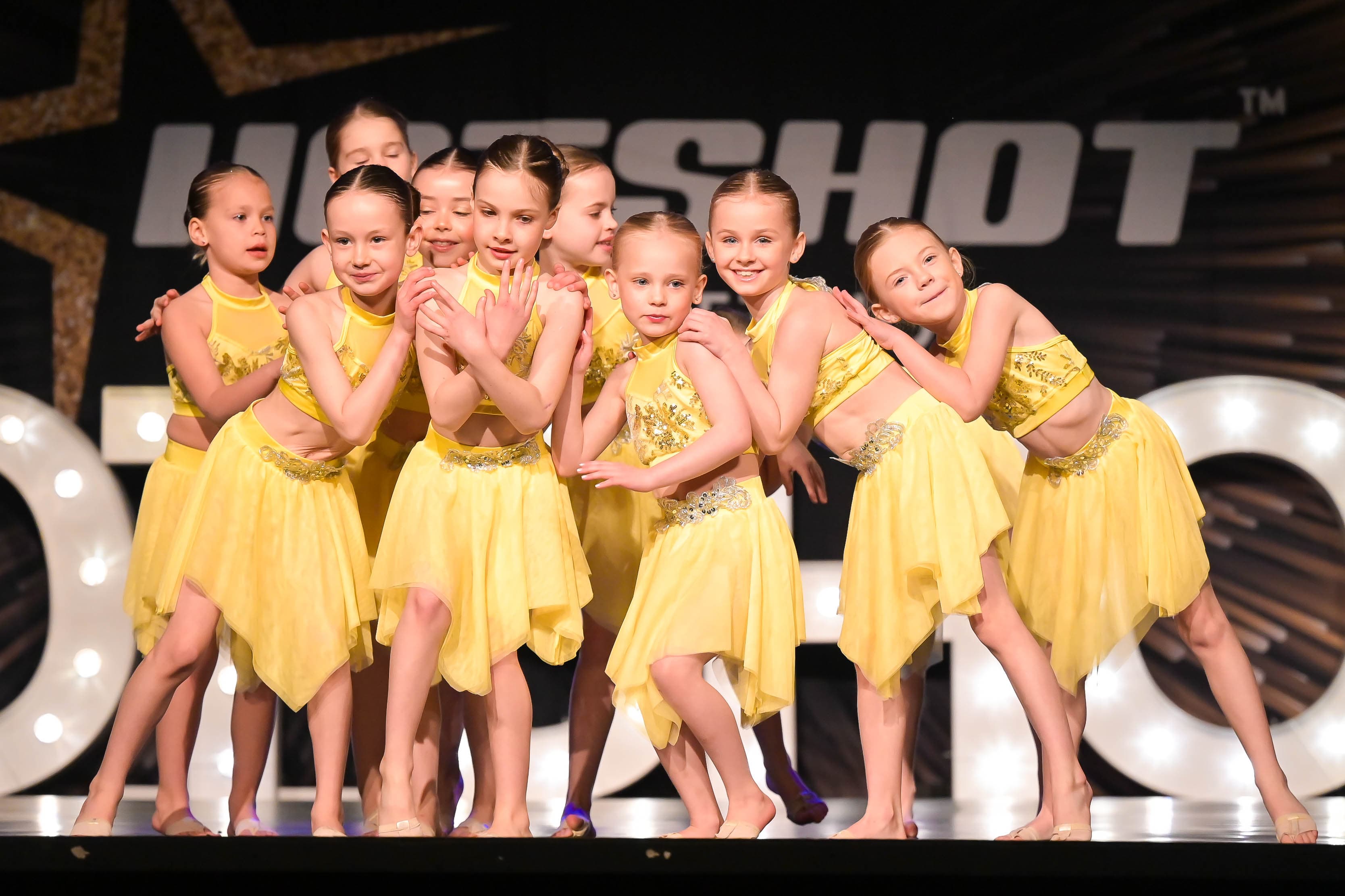 D2E Academy performers on stage