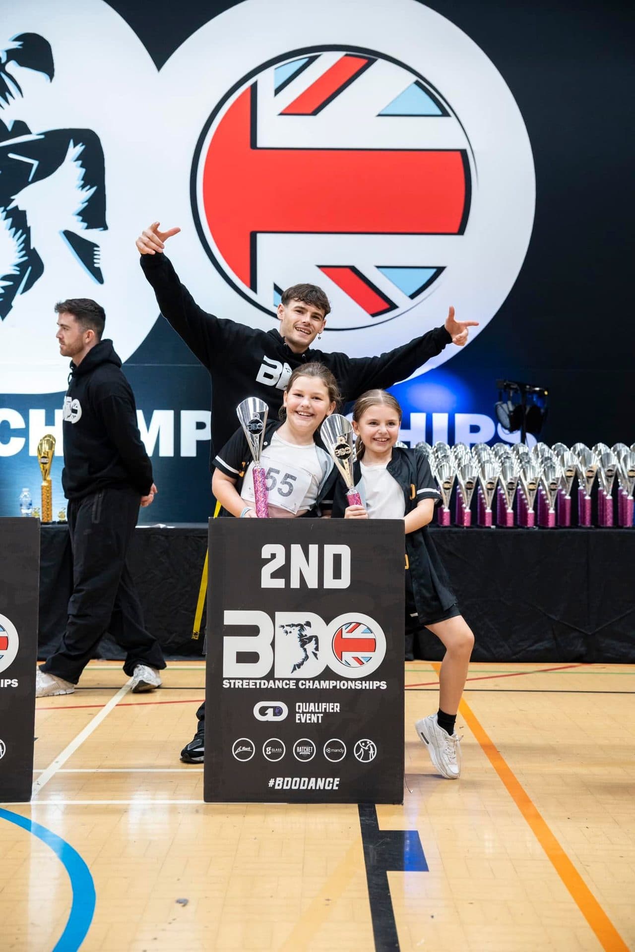 D2E Academy girls celebrating 2nd place at the BDO Dance Championships with their teacher