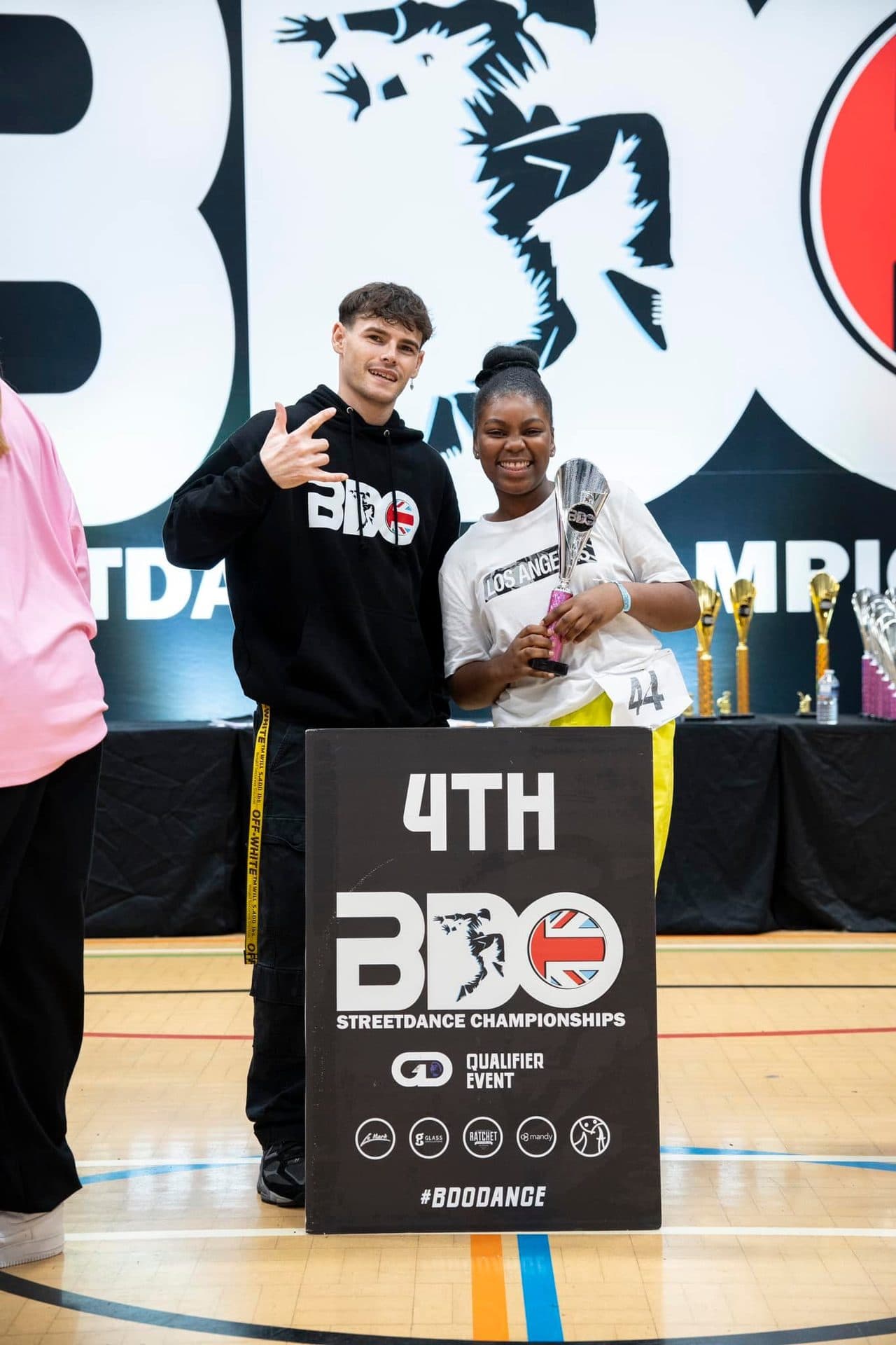 D2E dancers receiving a 4th place award from the judge at the BDO Championships