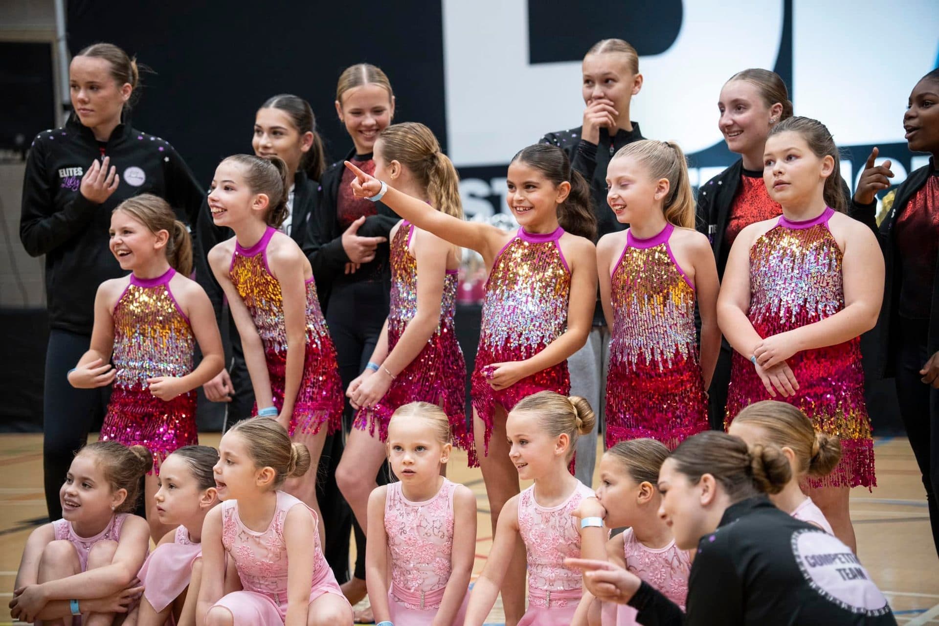 D2E competition team in costume backstage at the BDO Dance Championships